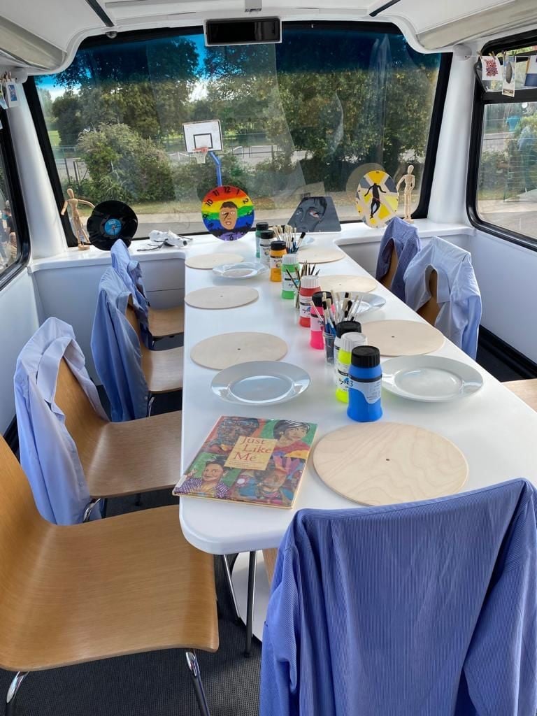 Bus interior with table and chairs